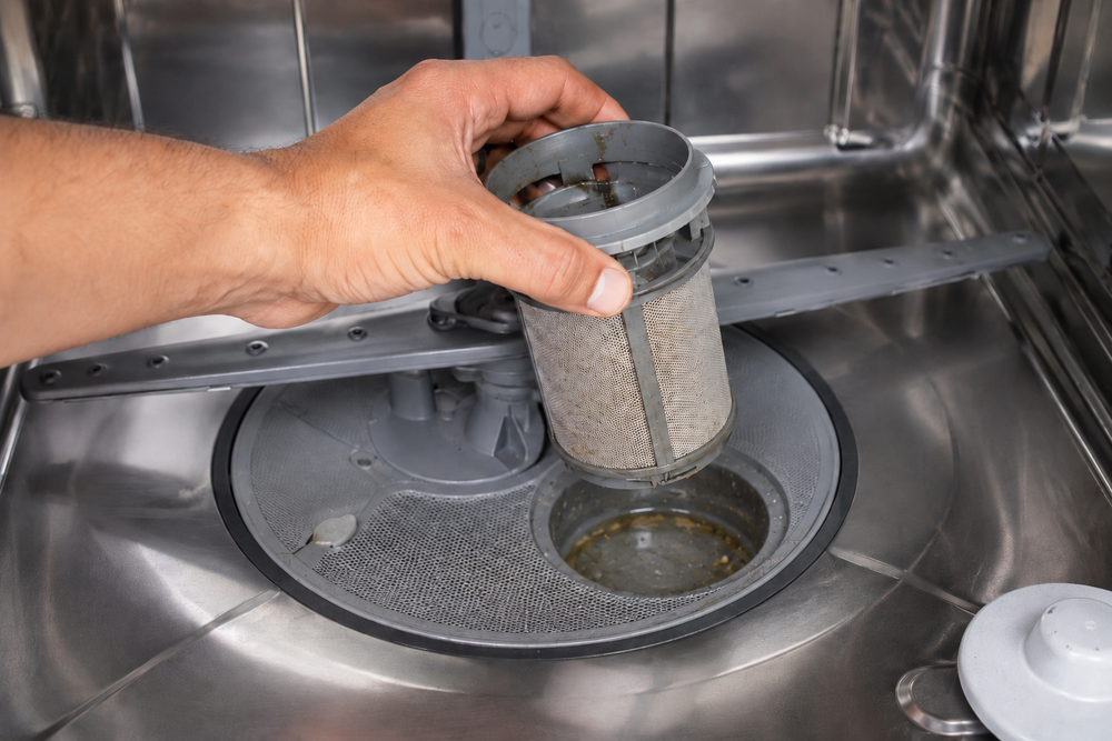 Your dishwasher smells, and it's coating your clean dishes